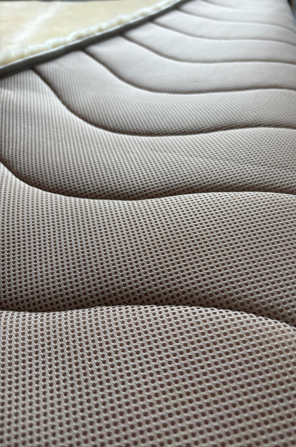 Australian Merino sheepskin rug, Sand, shorn pile and hide backing close up.